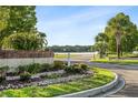Community entrance with landscaping and curved driveway at 125 S Shore Blvd. # 302, Longs, SC 29568