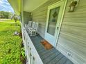 Quaint front porch with rocking chairs at 312 13Th Ave. S, Surfside Beach, SC 29575