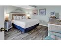 Main bedroom with king bed, TV, and dresser at 1501 S Ocean Blvd. # 1150, Myrtle Beach, SC 29577