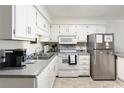 Well-equipped kitchen with stainless steel appliances and ample counter space at 191 Maison Dr. # B113, Myrtle Beach, SC 29572