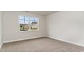 Spacious bedroom with neutral carpeting and large window at 368 Clear Lake Dr., Conway, SC 29526