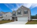 Two-story house with gray and beige siding at 7031 Shooting Star Way, Myrtle Beach, SC 29579