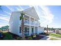 Two-story home with front porch and balcony at 7043 Shooting Star Way, Myrtle Beach, SC 29579