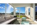Relaxing screened porch with seating area, perfect for enjoying the outdoors at 7043 Shooting Star Way, Myrtle Beach, SC 29579