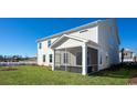 Spacious screened porch overlooking the backyard at 7043 Shooting Star Way, Myrtle Beach, SC 29579