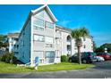 Exterior view of a three-story building with parking at 351 Arrowhead Dr. # 4-113, Myrtle Beach, SC 29572