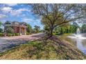 Gated community entrance with a pond and fountain at 955 Shipmaster Ave., Myrtle Beach, SC 29579