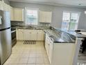 Modern kitchen with granite countertops and stainless steel appliances at 801 Crumpet Ct. # 1135, Myrtle Beach, SC 29579