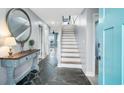 Bright entryway with stone floors and elegant console table at 1919 South Waccamaw Dr., Garden City Beach, SC 29576