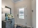 Bright entryway with a stylish console table and lamp at 360 Mayflower Dr., Calabash, NC 28467