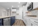 Modern kitchen, featuring double ovens, gas cooktop, and herringbone backsplash at 1958 Woodrush Loop, Little River, SC 29566