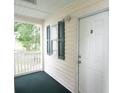 Condo exterior with a private balcony and white door at 533 White River Dr. # 18D, Myrtle Beach, SC 29579