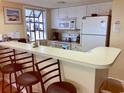 Kitchen with white cabinets, breakfast bar, and appliances at 351 Lake Arrowhead Rd. # 20-179, Myrtle Beach, SC 29572