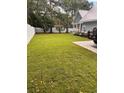 Spacious backyard with lush grass and white fence at 410 40Th Ave. N, Myrtle Beach, SC 29577