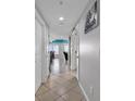 Bright hallway with tile floors and doors at 3401 N Ocean Blvd. # 306, North Myrtle Beach, SC 29582