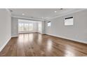 Bright and airy living room with hardwood floors and recessed lighting at 6620 Pozzallo Place, Myrtle Beach, SC 29572