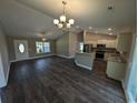 Open concept dining area with kitchen and vaulted ceilings at Tbd22 Privetts Rd., Conway, SC 29526