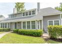Gray two-story house with a well-maintained lawn and shrubs at 1206 Benna Dr. # 4-F, Myrtle Beach, SC 29577