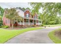 Brick house with wrap around porch at 5414 Hampton Rd., Conway, SC 29527