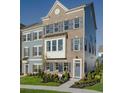 Three-story townhouse with brick and siding exterior, landscaping, and walkway at Tbd Swing Pl. # Tbd, Myrtle Beach, SC 29572