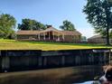 Back of house with canal view and patio at 5864 Crestwood Dr., Myrtle Beach, SC 29578