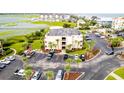 Aerial perspective of building, parking, and surroundings at 1582 S Waccamaw Dr. # 10, Murrells Inlet, SC 29576