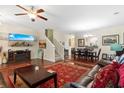 Comfortable living room featuring hardwood floors, a large TV, and ample seating at 444 Papyrus Circle # 444, Little River, SC 29566