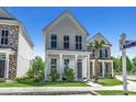 Two-story white house with gray front door and small front porch at 3507 Fountain Ln., Myrtle Beach, SC 29577