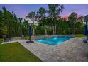 Inviting rectangular pool with a stone patio and water features at 2056 Summer Rose Ln., Myrtle Beach, SC 29579