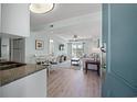 Open concept living space with light flooring and a light blue wall at 14290 Ocean Hwy. # 208, Pawleys Island, SC 29585