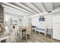 Bright dining area with a table, chairs, and whitewashed walls at 605 36Th Ave. S, North Myrtle Beach, SC 29582