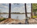 Peaceful waterfront view with trees and a sign at 4508-E Ailsa Ct. # 4508-E, Myrtle Beach, SC 29579