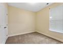 Simple bedroom with carpeted floor and window at 624 Bonaventure Dr. # 202, Myrtle Beach, SC 29572