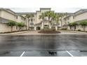 Condo building with palm trees and a well-maintained entrance at 2180 Waterview Dr. # 634, North Myrtle Beach, SC 29582
