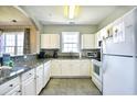 Simple kitchen with white cabinets and granite countertops at 5801 Oyster Catcher Dr. # 434, North Myrtle Beach, SC 29582