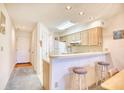 Small kitchen with light cabinets and breakfast bar at 4103 Pinehurst Circle # Bb-12, Little River, SC 29566