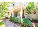 Inviting front porch with rocking chairs, and nicely landscaped yard at 147 Lake Trail, Pawleys Island, SC 29585