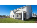 Spacious screened porch overlooks backyard at 7005 Shooting Star Way, Myrtle Beach, SC 29579