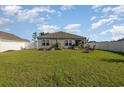Spacious backyard with grassy lawn and raised garden beds at 197 Golden Bear Circle, Longs, SC 29568