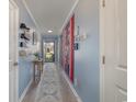 Inviting hallway showcasing a gallery wall and decorative rug at 197 Golden Bear Circle, Longs, SC 29568