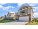 Two-story home with stone accents and a two-car garage at 1020 Barrington Way, Conway, SC 29526