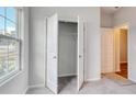 Bedroom with open closet and neutral color scheme at 331 Dunlin Pl, Conway, SC 29526