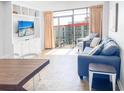 Living room with ocean view, comfy sofa, and dining area at 202 74Th Ave. N # 2447-2448, Myrtle Beach, SC 29572