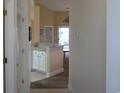 Kitchen with white cabinets and a breakfast bar at 5011 Harvest Dr. # 203, Myrtle Beach, SC 29579