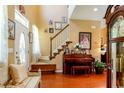 Elegant entryway with hardwood floors, a staircase, and a piano at 5356 Hamps Rd., Nichols, SC 29581