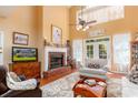 Spacious living room with a brick fireplace, high ceilings, and large windows at 5356 Hamps Rd., Nichols, SC 29581