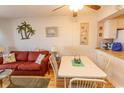 Bright dining area with table and chairs, adjacent to living room at 4305 S Ocean Blvd. # 106, North Myrtle Beach, SC 29582