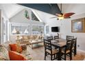 Charming dining area with vaulted ceilings, floral sofa and patio access at 351 Lake Arrowhead Rd. # 11-342, Myrtle Beach, SC 29572