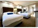 Two twin beds, dresser, and mirrored closet at 6900 Ocean Blvd. # 936, Myrtle Beach, SC 29572