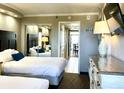 Two twin beds, dresser, and mirrored closet at 6900 Ocean Blvd. # 936, Myrtle Beach, SC 29572